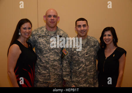 Newly-promoted Lt. Col. Steven M. Davenport and Col. Ronald M. Neely pose for a photo with their wives, Michelle and Nina (left to right). Both officers expressed their appreciation for their families and the National Guard family during their remarks. The promotion ceremony was held April 19 in Tuscaloosa, Alabama, at the 31st Chemical Biological Radiological Nuclear Brigade, Alabama National Guard armory. (Photo by Staff Sgt. Christopher W. Davis) National Guard family celebrates promotions 150423-A-IW994-003 Stock Photo