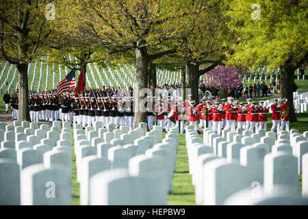 Marines from Marine Barracks Washington (8th and I), “The President’s Own” United States Marine Band and attendees of the graveside service for U.S. Marine Corps Maj. Elizabeth Kealey approach Section 71 in Arlington National Cemetery, April 27, 2015, in Arlington, Va. Kealey died in a helicopter crash while conducting training at Marine Corps Air Ground Combat Center Twentynine Palms, Calif., Jan. 23, according to a Marine Corps Air Station Miramar press release. (U.S. Army photo by Rachel Larue/released) US Marines and attendees approach graveside service in Arlington National Cemetery 15042 Stock Photo