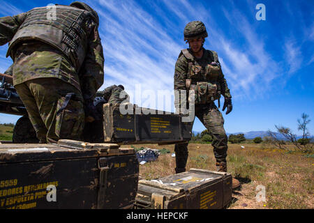 Spanish Soldiers from the Brigada Paracaidista recover ammunition following an airborne cargo drop during Operation Skyfall - España, Madrid, Spain, May 7, 2015.  Operation Skyfall - España is an exercise initiated and organized by the 982nd Combat Camera Company, and hosted by the Brigada Paracaidista of the Spanish army. The exercise is a bilateral subject matter exchange focusing on interoperability of combat camera training and documentation of airborne operations. (U.S. Army photo by Staff Sgt. Justin P. Morelli / Released) Operation Skyfall - Espa%%%%%%%%C3%%%%%%%%B1a 150507-A-PP104-181 Stock Photo