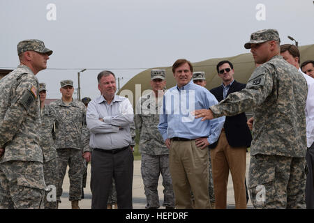 Delta Battery, 6-52 ADA Commander Capt. Benjamin Smith explains Patriot Battery day to day operations to Congressman Doug Lamborn, Congressman John Fleming and Seventh Air Force Commander, Lt. Gen. Terrence J. O'Shaughnessy at Osan Air Base, Korea, May 29. Congressmen tour US Patriot Missile site in Korea. 150529-A-DY706-537 Stock Photo