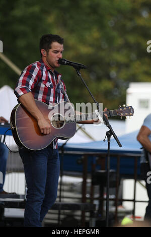 Easton Corbin, country singer, performs at the Fourth of July celebration, Fort Bragg, N.C. Corbin performed songs from all three of his albums and gave thanks to the men and women of the armed forces. (U.S. Army photo by Staff Sgt. Christopher Freeman/ 82nd CAB PAO) Fort Bragg Fourth of July celebration 150704-A-PB251-400 Stock Photo