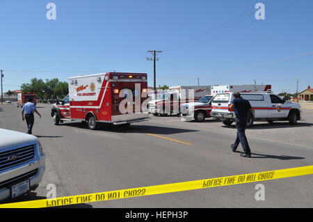 Emergency Medical Services' first responders from the El Paso Fire Department begin staging in preparation for treating casualties (volunteer role players) during Iron Response, an active shooter exercise that took place at the Soldier Resilience and Readiness Center on West Fort Bliss July 9. Emergency medical services and hospitals that collaborated in the exercise included: Border Regional Advisory Council, City of El Paso Emergency Management, El Paso County Sheriff, Elite Medical Transport EMS, Fort Hancock EMS, Life Ambulance Services, and El Paso Fire EMS. Iron Response, On the ground o Stock Photo