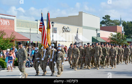 Soldiers from 1st Battalion, 64th Armor Regiment marched in the Brooklet Peanut Festival in Brooklet, Ga., Aug. 16. The 26th annual festival included a 5k race, parade, slow tractor race, arts and crafts vendors, a street dance and live entertainment, which included members of the 3rd Infantry Division Band. Brooklet Peanut Festival 150815-A-CY863-001 Stock Photo