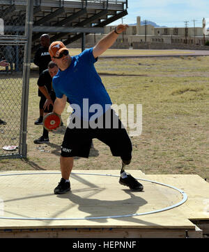 Athletes practice discus throwing during the 2014 Marine Corps Trials ...