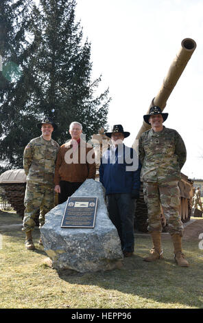 Col. John V. Meyer III (left,) the 78th colonel of the Regiment, Retired Lt. Gen. Leonard D. Holder (middle left,) the 65th colonel of the Regiment, Retired Lt. Col. Timothy Gauthier (middle right,) a former scout platoon leader with Eagle Troop and Lt. Col. Steven E. Gventer (right,) squadron commander for 2nd Squadron, 2nd Cavalry Regiment, pose together for a photo in between a T-72 Iraqi Tank and bronze plaque after the squadron's Battle of 73 Easting commemoration ceremony held at Rose Barracks, Germany, March 11, 2016. The event was in celebration of the 25th anniversary of the unit's hi Stock Photo