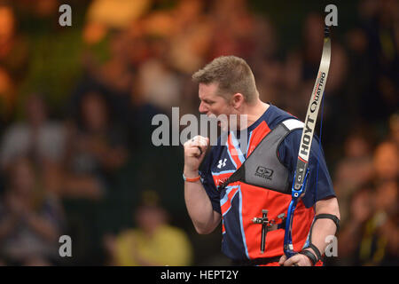 Gareth Paterson of Team United Kingdom reacts after winning his match during the archery finals of the 2016 Invictus Games at the ESPN Wide World of Sports Complex, Orlando, Fla., May 9, 2016. The Invictus Games are an adaptive sports competition which was created by Prince Harry of the United Kingdom after he was inspired by the DoD Warrior Games. This event brings together wounded, ill, and injured service members and veterans from 15 nations for events including: archery, cycling, indoor rowing, powerlifting, sitting volleyball, swimming, track and field, wheelchair basketball, wheelchair r Stock Photo