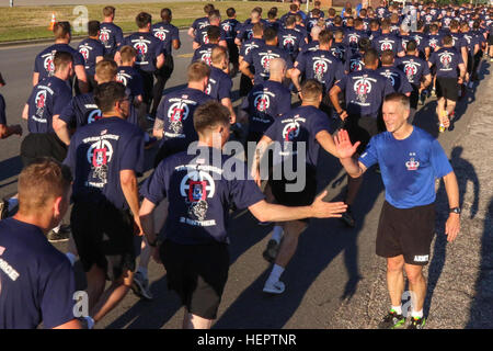 Maj. Gen. Richard Clarke, commanding general of the 82nd Airborne Division, cheers on Paratroopers assigned to 2nd Battalion, 505th Parachute Infantry, 3rd Brigade Combat Team, 82nd Abn. Div. during the All American Week 2016 Division Run at Fort Bragg, N.C., May 23. All American week is an opportunity for 82nd Abn. Div. Paratroopers, past and present, and their Families to come together and enjoy the camaraderie and celebrate being members of the All American Division. This year’s All American Week theme is “Tomorrows Force, Today”. (U.S. Army Photo by Sgt. Anthony Hewitt/ Released) All Ameri Stock Photo