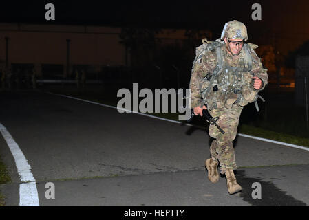 1st Lt. Nicholas Kiser a platoon leader from Company A, 2nd Battalion, 5th Cavalry Regiment, 1st Armored Brigade Combat Team completes the 12-mile ruck march May 26 for the Expert Infantryman Badge in a little over 2 hours at the Schoonover Bowl on Camp Casey, South Korea. 627 Soldiers attempted to earn the US Army’s EIB, by the time the testing was done 131 US and Republic of Korea Soldiers had earned it. (U.S. Army photo by Staff Sgt. Keith Anderson, 1st Armored Brigade Combat Team Public Affairs, 1st Cav. Div.) First in EIB ruck (Image 1 of 8) 160526-A-WU248-089 Stock Photo