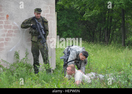 Members of the PA National Guard's 2-112th Infantry Battalion, 56th Stryker Brigade, 28th Infantry Division, train with Lithuanian soldiers in June 2006 as part of the National Guard's State Partnership Program. Pennsylvania National Guard members concurrently trained in Lithuania and Estonia as part of multinational exercises there. PA National Guard's 2-112th Infantry Trains with Lithuanian Counterparts (Image 1 of 7) 160603-A-TN333-039 Stock Photo