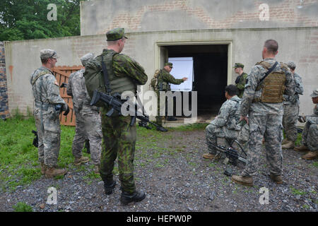 Members of the PA National Guard's 2-112th Infantry Battalion, 56th Stryker Brigade, 28th Infantry Division, train with Lithuanian soldiers in June 2006 as part of the National Guard's State Partnership Program. Pennsylvania National Guard members concurrently trained in Lithuania and Estonia as part of multinational exercises there. PA National Guard's 2-112th Infantry Trains with Lithuanian Counterparts (Image 1 of 7) 160603-A-TN333-257 Stock Photo