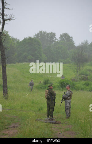 Members of the PA National Guard's 2-112th Infantry Battalion, 56th Stryker Brigade, 28th Infantry Division, train with Lithuanian soldiers in June 2006 as part of the National Guard's State Partnership Program. Pennsylvania National Guard members concurrently trained in Lithuania and Estonia as part of multinational exercises there. PA National Guard's 2-112th Infantry Trains with Lithuanian Counterparts (Image 1 of 7) 160603-A-TN333-503 Stock Photo