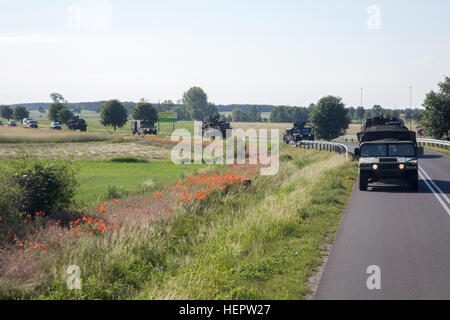 U.S. Soldiers attached to 4th Squadron, 2nd Cavalry Regiment during Dragoon Ride II, convoy from Powidz to Bydgoszcz, Poland, June 5, 2016. Dragoon Ride II, is the 2,200 kilometer convoy to Estonia in preparation for Exercise Saber Strike 2016, a U.S. Army Europe-led cooperative training exercise designed to improve joint interoperability to support multinational contingency operations. (U.S. Army photo by Staff Sgt. Ricardo HernandezArocho/Released) Dragoon Ride II Powidz to Bydgoszcz, Poland 160605-A-DM872-143 Stock Photo