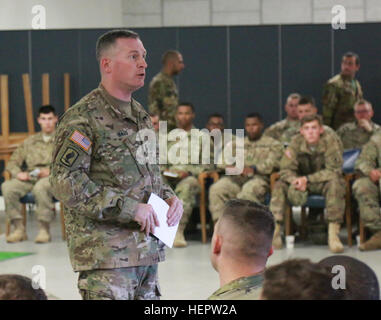 Lt. Col. Eric Baus, the deputy commander of the 173rd Airborne Brigade, speaks to his troops during a mission brief, June 5, 2016, on Rhine Ordnance Barracks, Germany, during exercise Swift Response 16. Swift Response includes more than 5,000 Soldiers and Airmen from Belgium, France, Germany, Great Britain, Italy, the Netherlands, Poland, Portugal, Spain and the United States and takes place in Poland and Germany, May 27-June 26, 2016. (U.S. Army photo by Sgt. Kenneth D. Reed/Released) Swift Response 16, Joint Forcible Entry (Image 1 of 4) 160605-A-XJ896-002 Stock Photo