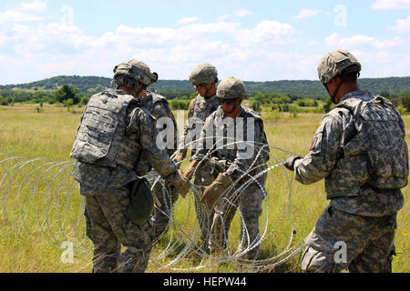 Soldiers of the 287th Engineer Company, 890th Engineer Battalion, set up an Entry Control Point at the Command Post of the Special Troops Battalion, 155th Armored Brigade Combat Team on June 7, 2016, at Fort Hood, Texas. The 287th En. Co. is an enabler unit for the 155th Armored Brigade Combat Team’s Multi-integrated Echelon Brigade Training Exercise. (Mississippi National Guard photos by Sgt. Brittany Johnson 155th Armored Brigade Combat Team Public Affairs/Released) Entry Control Point 160607-A-MA423-002 Stock Photo