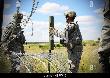 Soldiers of the 287th Engineer Company, 890th Engineer Battalion, set up an Entry Control Point at the Command Post of the Special Troops Battalion, 155th Armored Brigade Combat Team on June 7, 2016, at Fort Hood, Texas. The 287th En. Co. is an enabler unit for the 155th Armored Brigade Combat Team’s Multi-integrated Echelon Brigade Training Exercise. (Mississippi National Guard photos by Sgt. Brittany Johnson 155th Armored Brigade Combat Team Public Affairs/Released) Entry Control Point 160607-A-MA423-004 Stock Photo