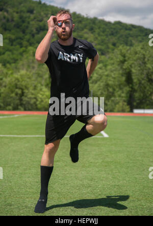A U.S. Army veteran trains in track and field at the United States Military Academy in West Point, New York, on June 12, 2016, preparing for the Department of Defense Warrior Games. The Warrior Games, held June 15-21, are an adaptive sports competition for wounded, ill, and injured service members and veterans, featuring multiple disciplines including archery, cycling, track, field, shooting, sitting volleyball, swimming, and wheelchair events, with participants from U.S. and UK military teams. Stock Photo