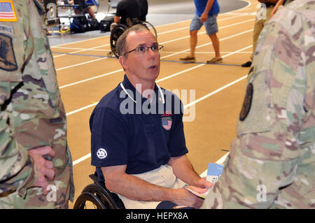 Dr. Rory Cooper talks to Soldiers at the Archery competition at the 2016 Department of Defense Warrior Games held at the U.S. Military Academy at West point, New York, June 17, 2016. Cooper is the founder and senior researcher at the University of Pittsburgh Human Engineering Research Labs (HERL), is a world-renowned expert in wheeled mobility and the pioneer in wheelchair selection and configuration. Dr. Cooper‘s success extends beyond science and VA research; he won a bronze medal at the 1988 Seoul Paralympics in the 4x400-meter wheelchair relay and 4th place in the 10,000-meter wheelchair r Stock Photo