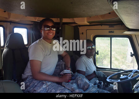 Spc. Shanita Macklin (left) and Spc. Angelica Colbert (right), heavy equipment operators with the 168th Engineer Brigade, Mississippi Army National Guard operate a 10-ton dump truck on June 25, 2016 during Operation Resolute Castle at Novo Selo Training Area, Bulgaria.  For several weeks, these women operated heavy construction equipment to build a tank maneuver lane and ammunition holding area as part of this U.S. led operation devoted to Eastern European security.  (U.S. Army Photo by 1st Lt. Matthew Gilbert, 194th Engineer Brigade, Tennessee Army National Guard) Mississippi State Students P Stock Photo