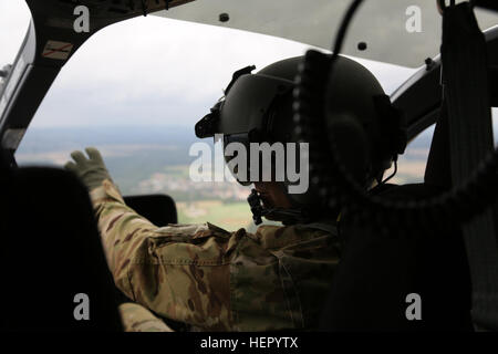 A soldier from the Falcon Observer Coach Trainer Team observes Volcano ...
