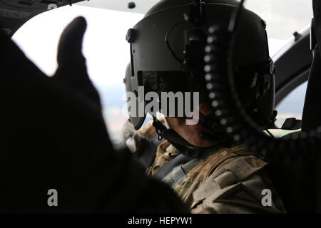 A soldier from the Falcon Observer Coach Trainer Team observes Volcano ...