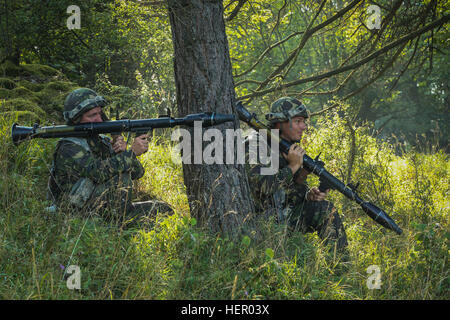 Romanian soldiers of the 33rd Mountain Battalion Posada fire simulated rocket propelled grenade launchers while conducting a simulated attack during exercise Combined Resolve VII at the U.S. Army’s Joint Multinational Readiness Center in Hohenfels Germany, Sept. 11, 2016. Combined Resolve VII is a 7th Army Training Command, U.S. Army Europe-directed exercise, taking place at the Grafenwoehr and Hohenfels Training Areas, Aug. 8 to Sept. 15, 2016. The exercise is designed to train the Army’s regionally allocated forces to the U.S. European Command. Combined Resolve VII includes more than 3,500 p Stock Photo