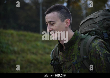 A Lithuanian soldier participates in the 12 mile Ruck March event as part of the European Best Sniper Squad Competition at the 7th Army Training Command's Grafenwoehr Training Area, Germany, Oct. 27, 2016. The European Best Sniper Squad Competition is an Army Europe competition challenging militaries from across Europe to compete and enhance teamwork with Allies and partner nations. (U.S. Army photo by Spc. Sara Stalvey) 2016 European Best Sniper Squad Competition 161027-A-VL797-043 Stock Photo