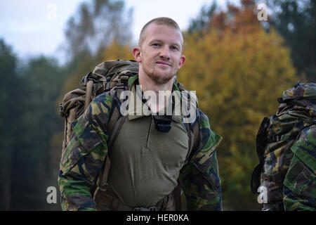 A Dutch soldier participates in the 12 mile Ruck March event as part of the European Best Sniper Squad Competition at the 7th Army Training Command's Grafenwoehr Training Area, Germany, Oct. 27, 2016. The European Best Sniper Squad Competition is an Army Europe competition challenging militaries from across Europe to compete and enhance teamwork with Allies and partner nations. (U.S. Army photo by Spc. Sara Stalvey) 2016 European Best Sniper Squad Competition 161027-A-VL797-059 Stock Photo