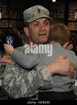 Indiana National Guard's, 76th Infantry Brigade Combat Team, Headquarters and Headquarters Company, 1st Battalion, 151st Infantry Regiment, 1st Lt. Billy Singer, from Covington, Ky., holds his son Liam, 5, during a reception ceremony at Stout Field in Indianapolis after a deployment to Iraq Thursday, Nov. 20. 76th Brigade Soldiers return to warm welcome 130358 Stock Photo