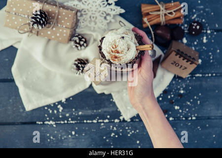 Girl holding a hot chocolate drink Stock Photo
