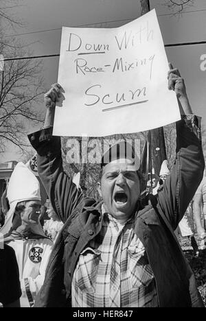 Ku Klux Klan members and supporters jeer and taunt African American civil rights marchers in Monroe, Georgia. Stock Photo