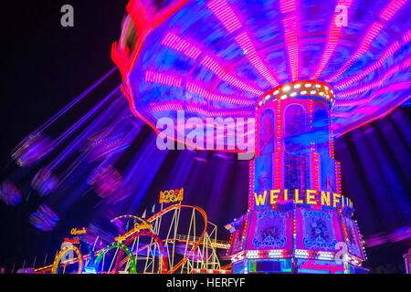 Swings carousel in motion, night scene, Oktoberfest, Munich, Bavaria, Germany Stock Photo