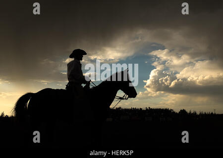 Silhouette of a cowboy on a horse, Wyoming, United States Stock Photo