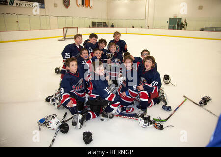 Portrait of boys hockey team trying to look happy after winning the consolation trophy cup. St Paul Minnesota MN USA Stock Photo