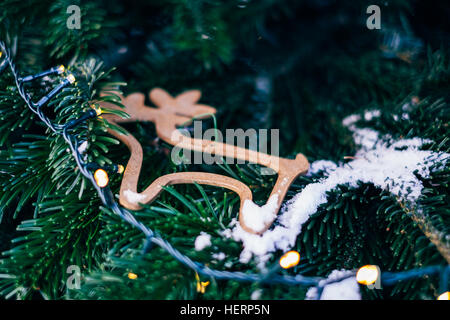 Close-up of reindeer decoration and lights on a Christmas tree Stock Photo