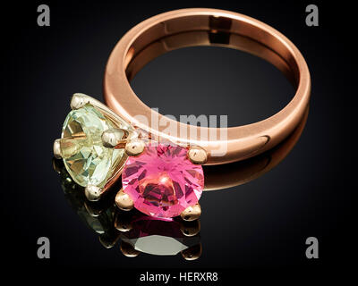 Golden ring with gemstone isolated on black background. Stock Photo