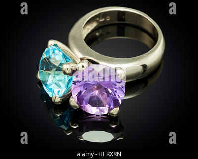 silver ring with gemstone isolated on black background. Stock Photo