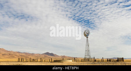 Dry Windmill and corral in the Nevada Desert. Stock Photo