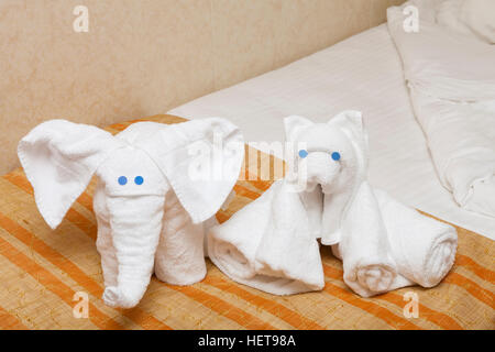 Folded Towel animals on bed in cruise ship Stock Photo