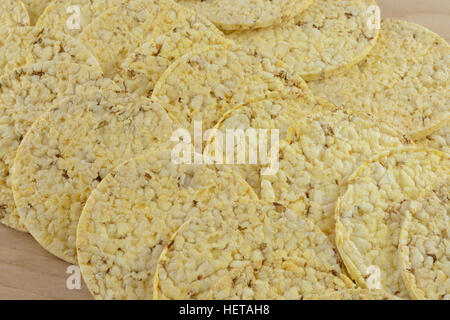 Close up of popped corn cakes on wooden table Stock Photo