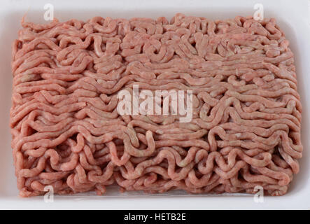 Close up of raw ground chuck beef hamburger meat in butcher polystyrene packaging Stock Photo