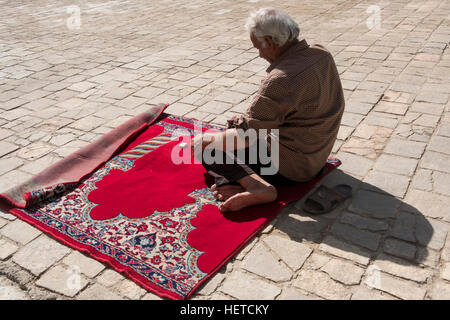 A man praying at the Jame Mosque in Isfahan, Isfahan Province, Iran Stock Photo