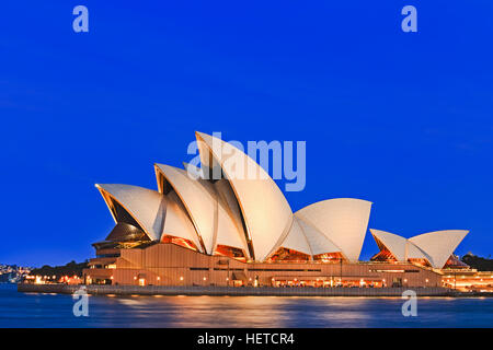 Sydney, Australia - 15 November 2016: Iconic worlds' buildings - Sydney Opera house in full glory at sunset, brightly illuminated. Stock Photo