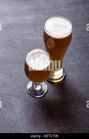 Two beer glasses on a classic textured blackboard Stock Photo