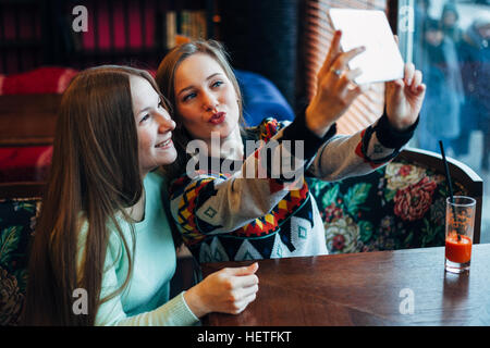 Selfie girls in cafe Stock Photo