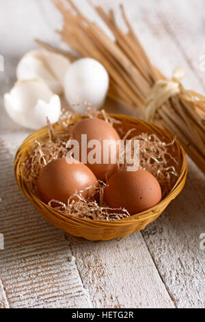 Organic chicken eggs in basket Stock Photo