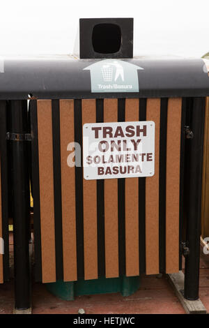 Trash only can sign in English and Mexican solamente basura Stock Photo