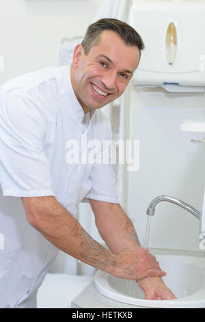 Portrait of doctor washing hands Stock Photo