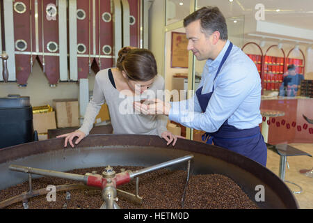 two auditers looking at coffee grains Stock Photo