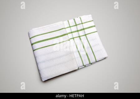White Tablecloth made of linen with green stripes for the dish on a white background isolated Stock Photo