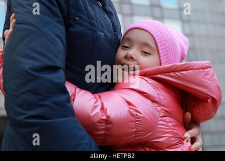 Happy family moments - Mother and child having fun in the city Stock Photo